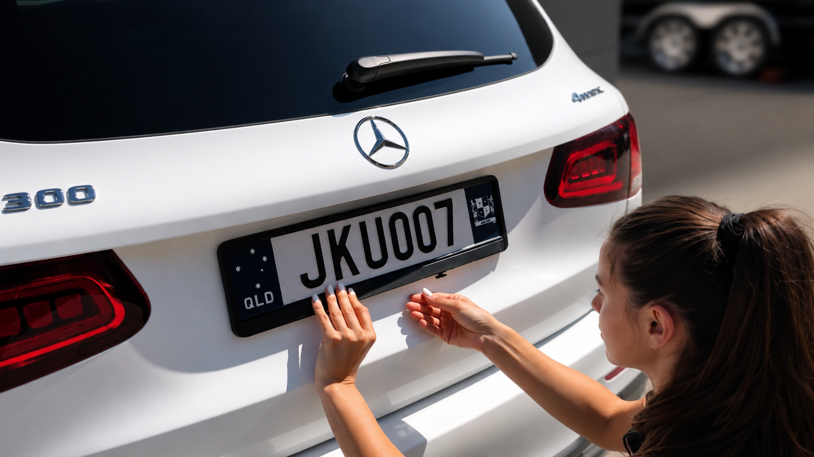 No-drill rego frame installed on a Queensland number plate for secure Australian vehicle plate fitment